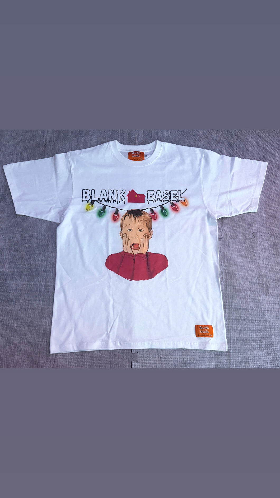 White Blank Easel “Christmas at Kevin’s” Tee